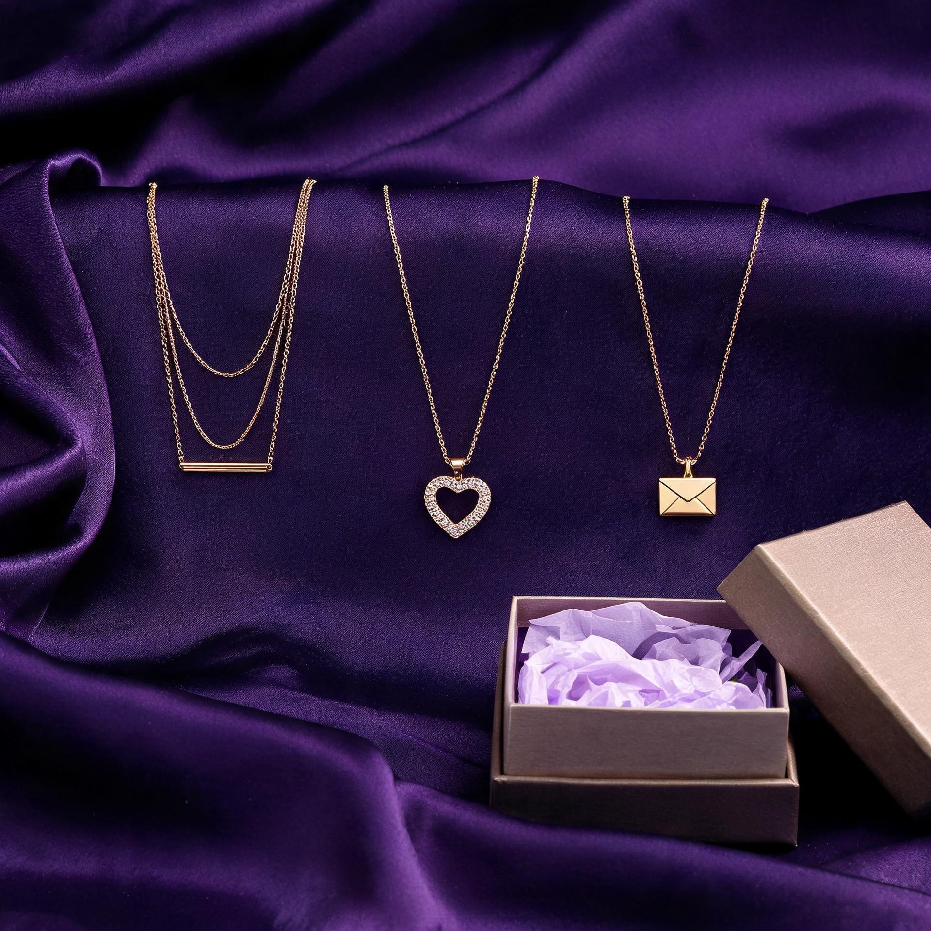 WowStore Mystery Set - Golden Layers Edition: three gold-tone necklaces on amethyst silk with gift box