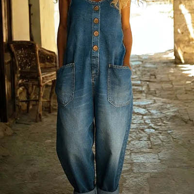 Wide-leg overall jumpsuit in medium blue denim-look print, front view on model, scoop neck, button placket, large patch
