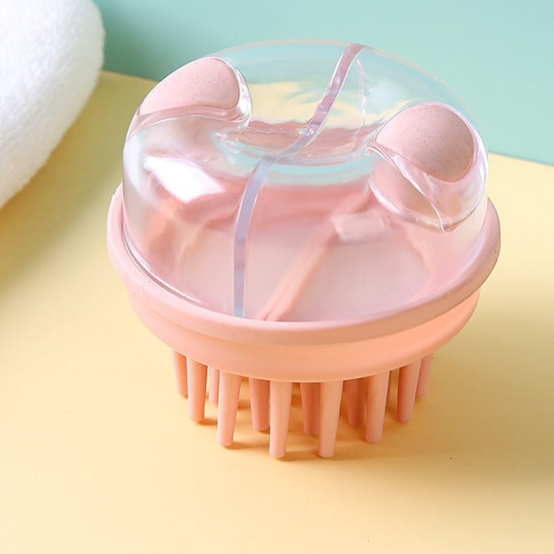 Pink shampoo brush with dispenser, angled top view on a yellow and mint background