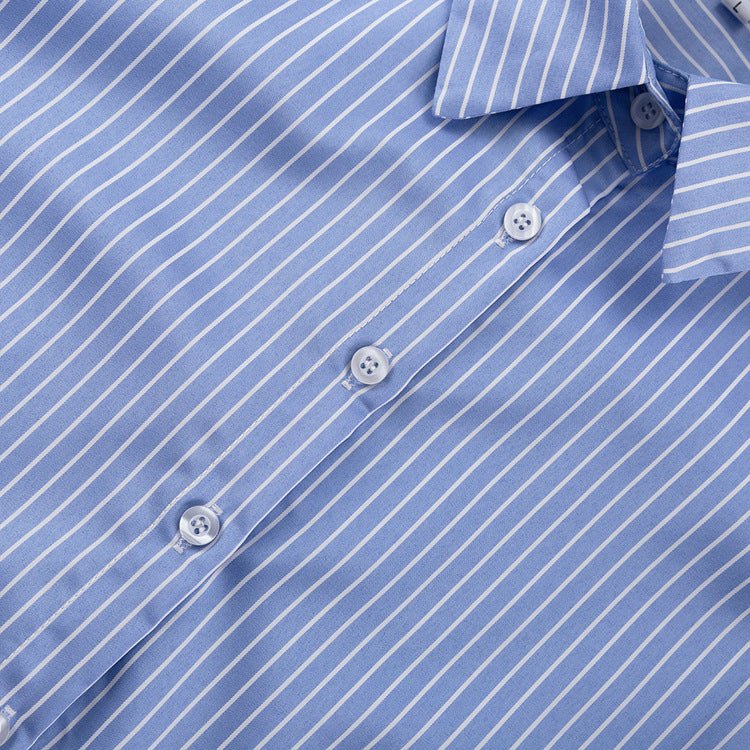 Close-up of the blue and white striped shirt front placket with round buttons
