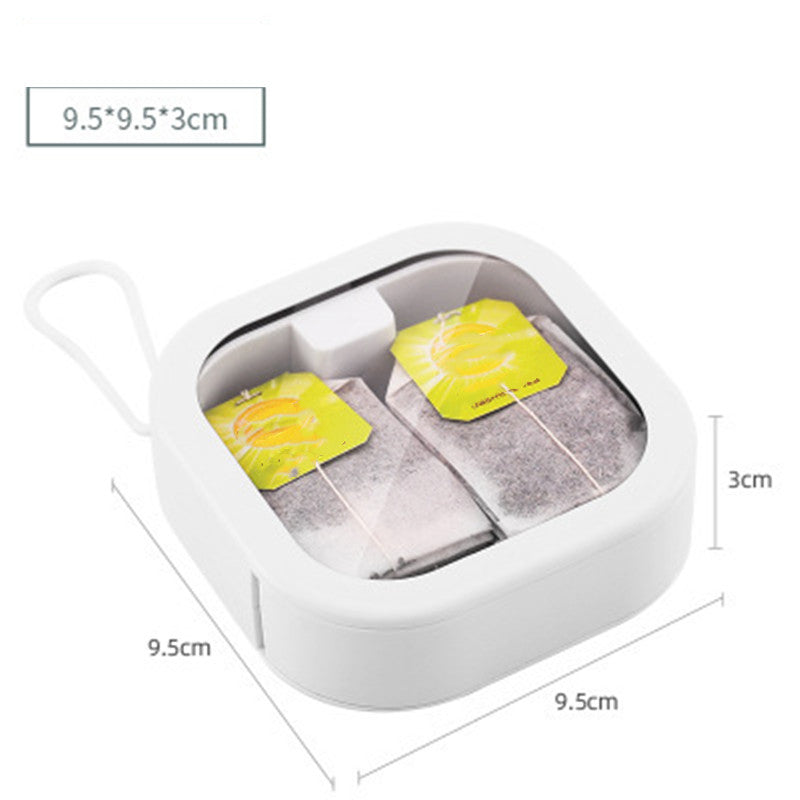 Size chart for compact storage case showing dimensions: 9.5 x 9.5 x 3 cm, with two tea bags inside