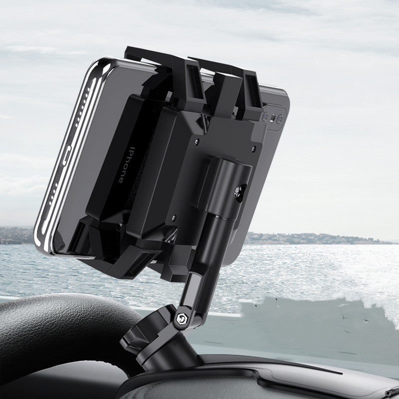 Adjustable clip-mount car phone holder in black, mounted on steering wheel, holding a smartphone, viewed from side in use