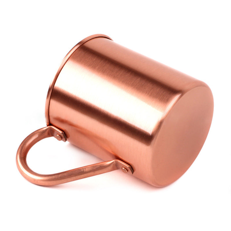 Copper cocktail mug with handle, empty, side view, brushed finish, white background