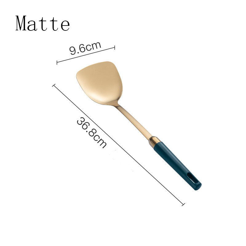 Gold-tone solid turner with teal handle, matte finish, size chart showing 36.8cm length and 9.6cm head width