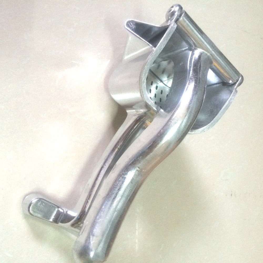 Aluminium hand-lever citrus press side view, on light surface