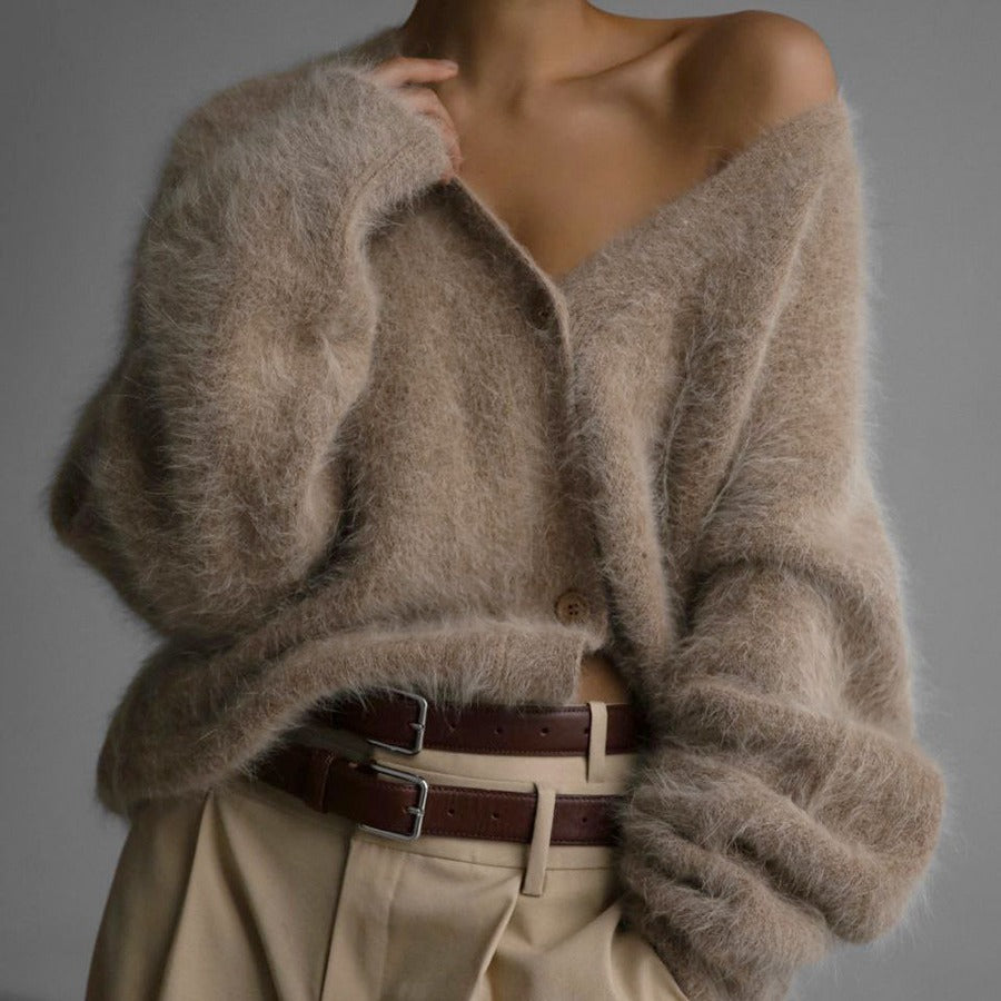 Fluffy oversized V-neck cardigan in beige, front view on model, button front, paired with wide pants and brown belt