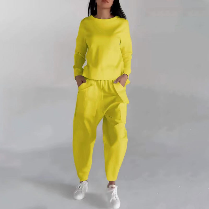 Yellow round-neck sweatshirt and jogger trousers set, front view on model