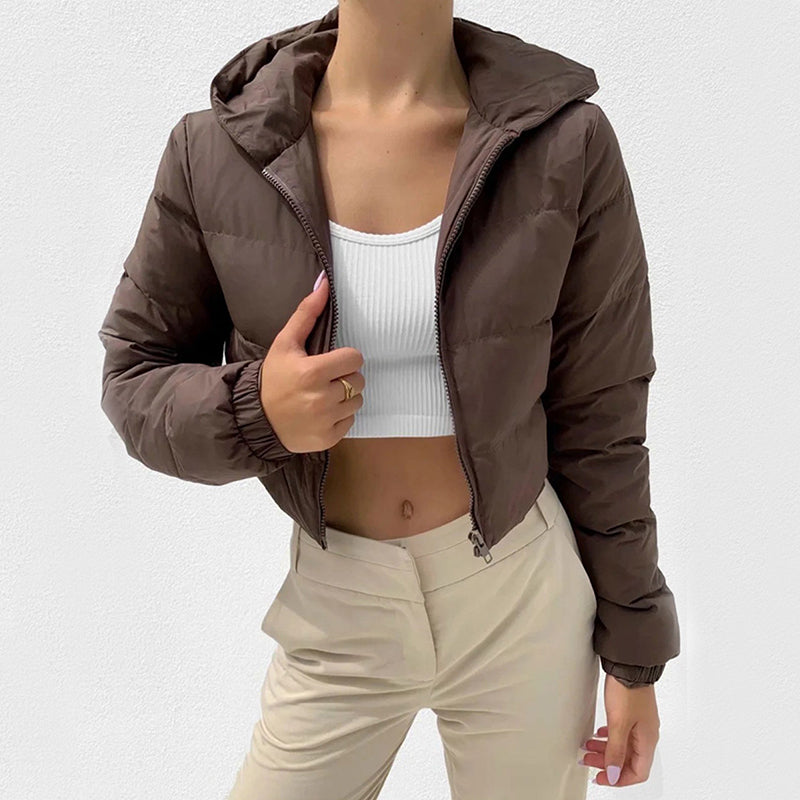 Coffee brown cropped hooded puffer jacket, worn by a model over a white crop top, front view