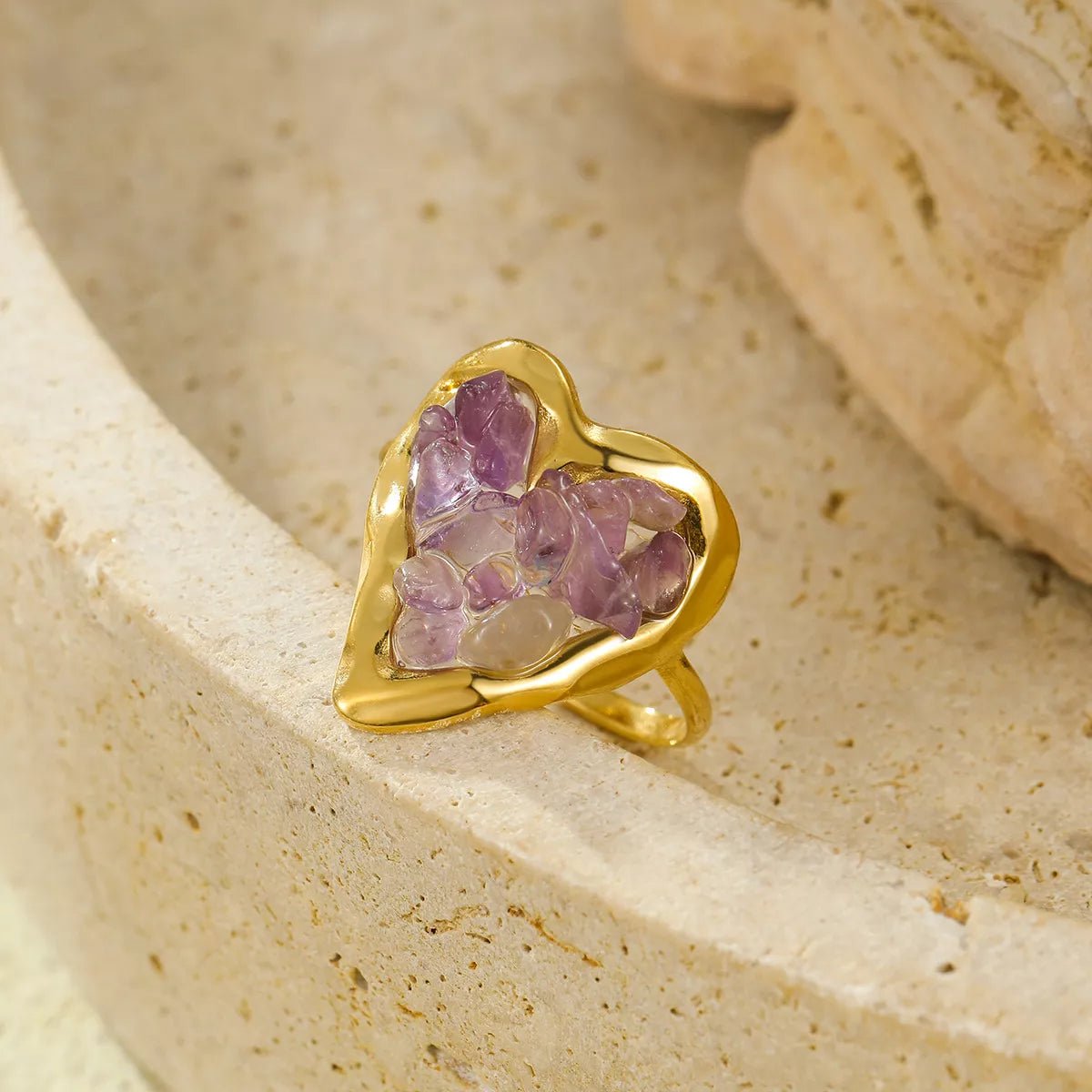 Gold-plated heart-shaped ring on finger, romantic jewelry piece for women