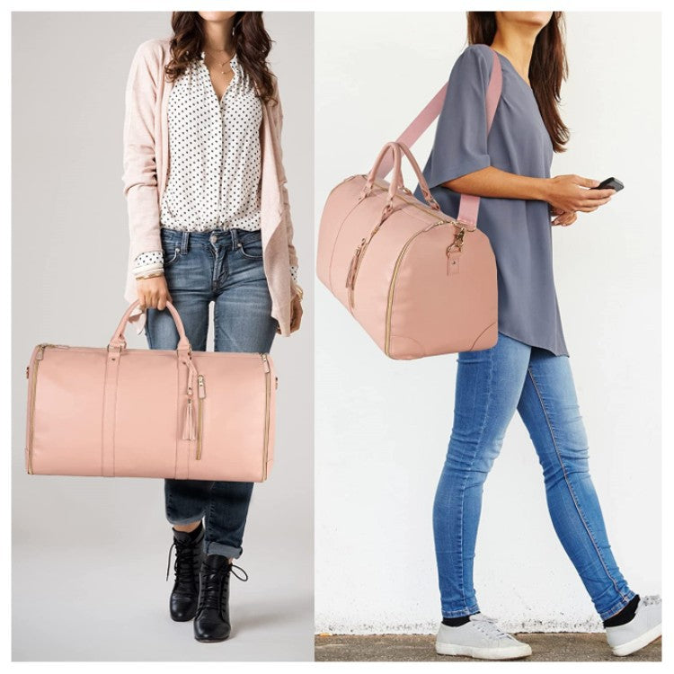 Pink foldable duffle bag carried by two women, one holding it by handles, the other wearing it on shoulder