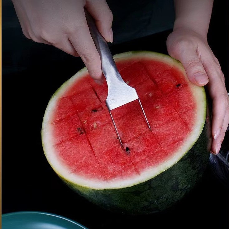 2-in-1 stainless steel watermelon fork and cutter, silver, scoring watermelon flesh, top-down view