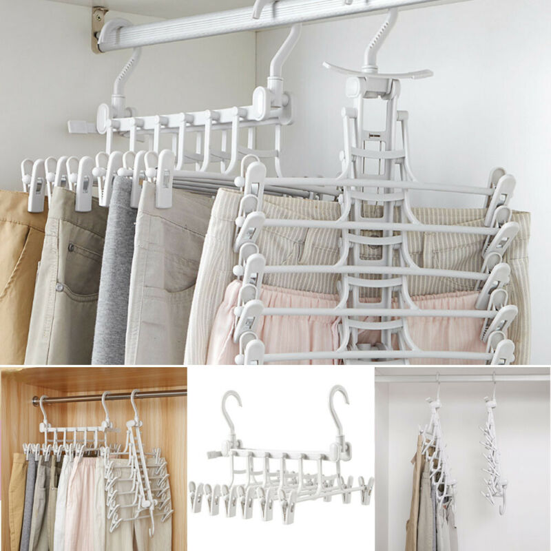 White 5-tier hangers with clips, multiple units hanging on rod, full view in closet setting