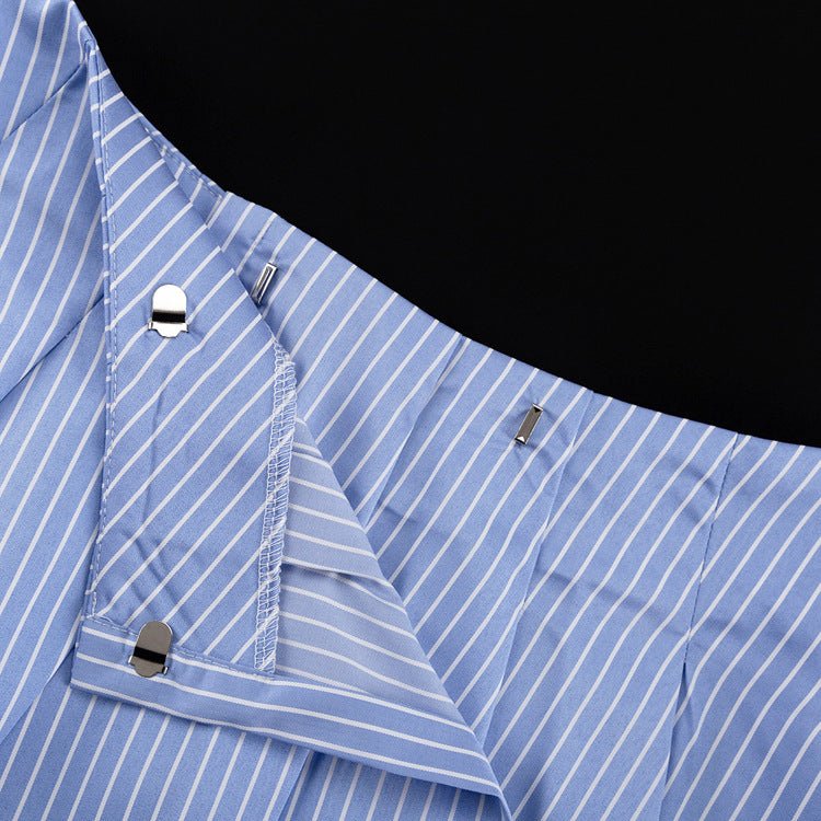 Close-up of the pleated mini skirt side closure with hook-and-eye fasteners