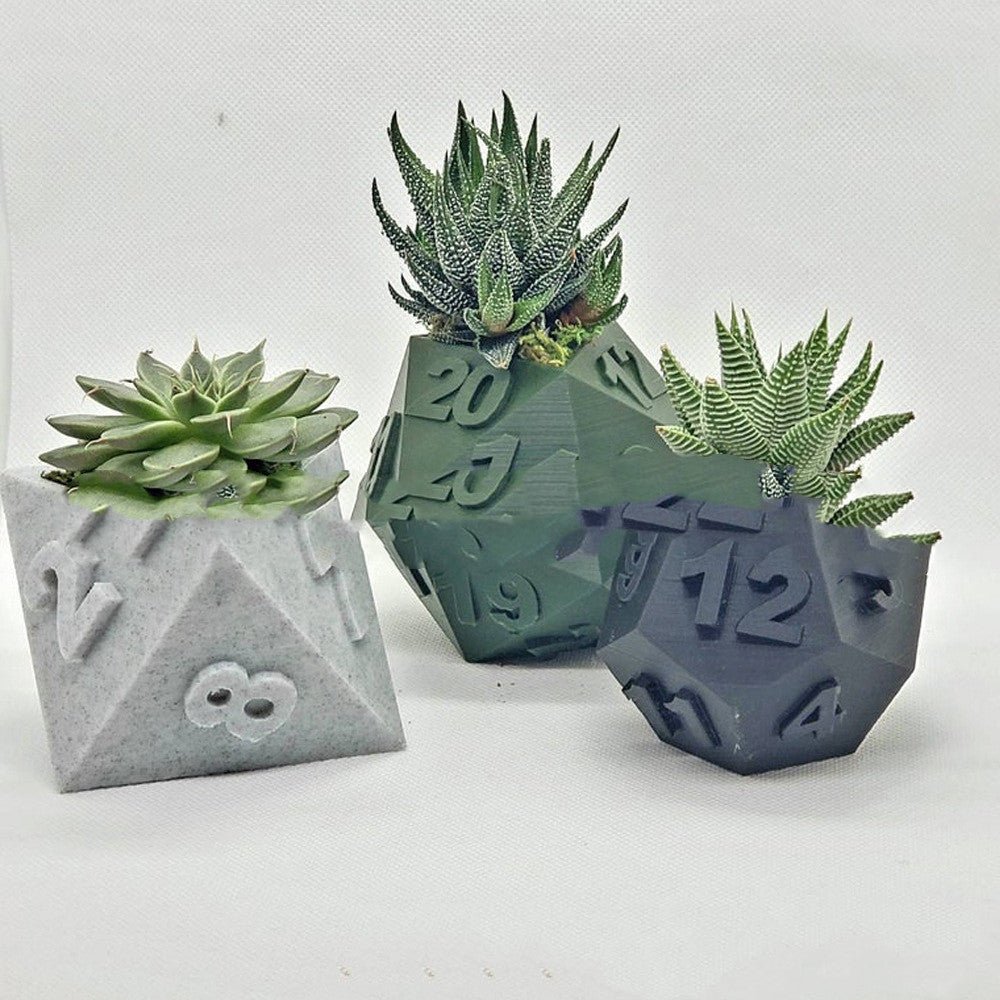 Three Multi-Sided Dice-Shape Succulent Planters in grey, green, and dark blue, each with succulents, side-by-side