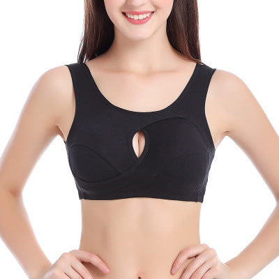 Black wire-free keyhole bra, front close-up on model with hands on hips