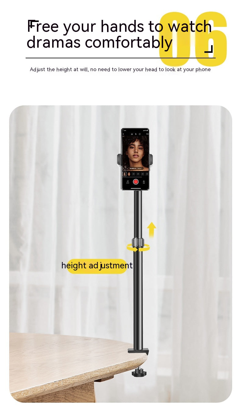 Telescopic desk stand in use, phone mounted vertically, height adjustment shown, on wooden table