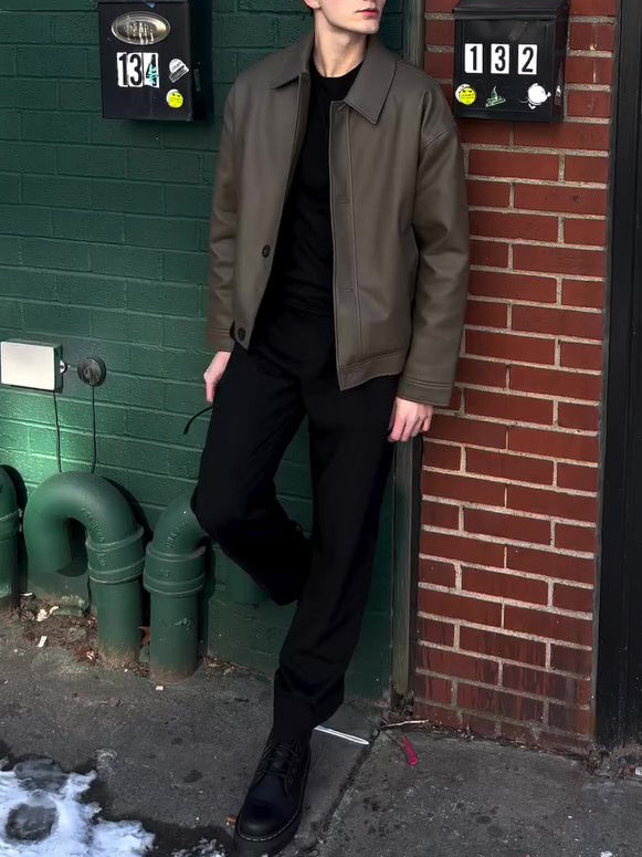 Olive leather-look bomber jacket, front view with button placket and flap pocket visible