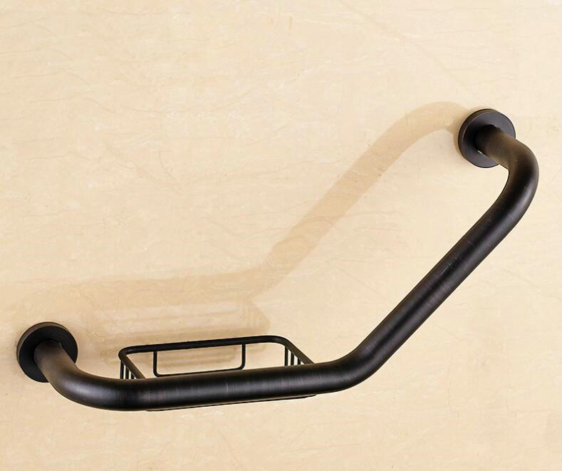 Black wall grab bar with wire soap basket, angled design mounted on beige wall