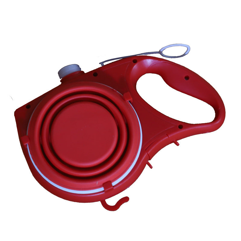 Dog lead with built-in water bottle and fold-out bowl, red, top view showing folded bowl and handle