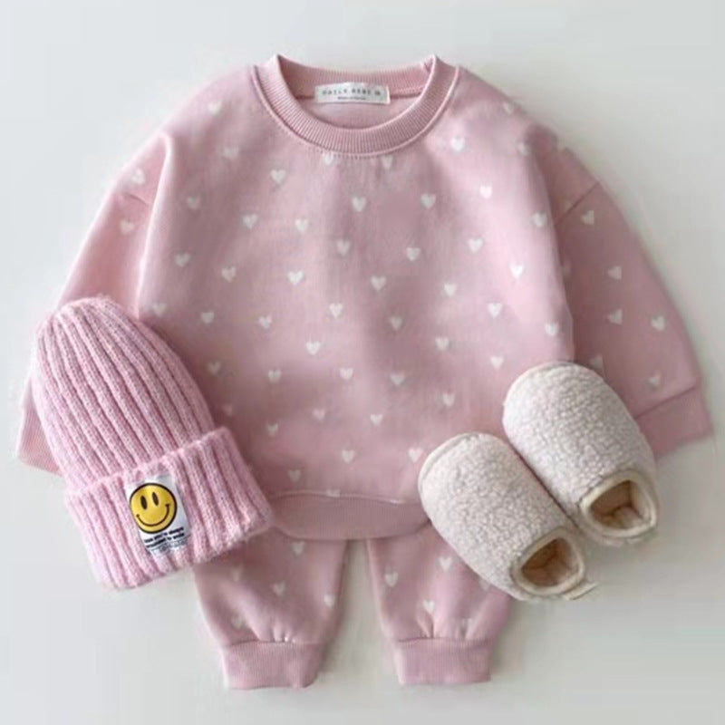 Pink sweatshirt and trousers with white hearts