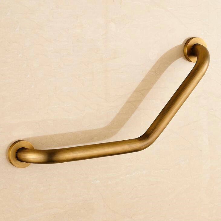 Antique gold wall grab bar, angled design mounted on beige wall