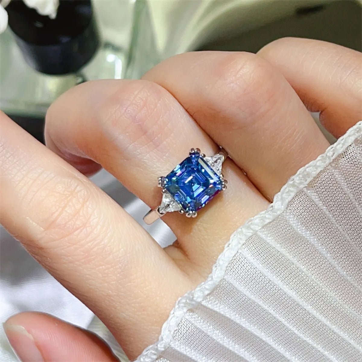 Radiant 3 carat moissanite ring set in polished sterling silver with intricate prong setting and geometric band detail