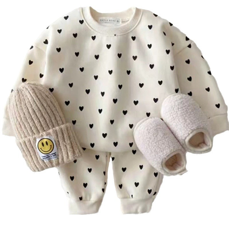 Cream heart print set laid flat, front view