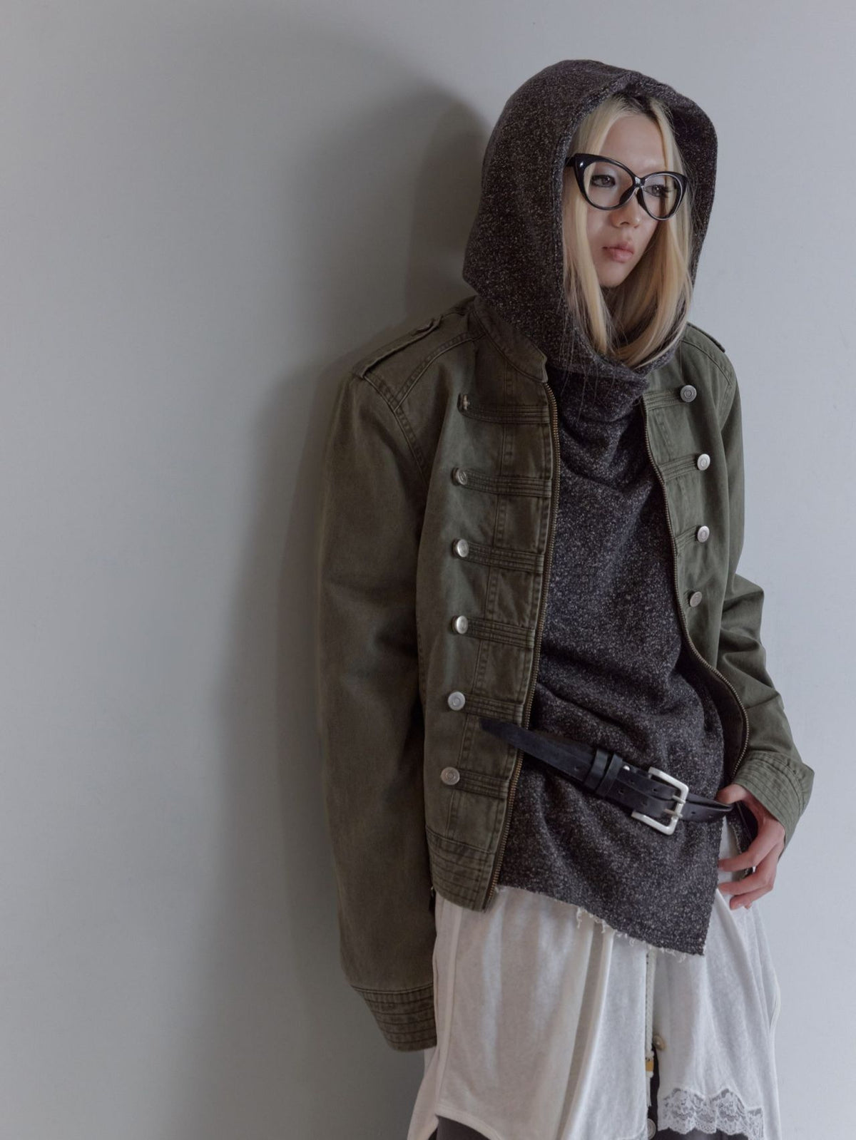 Army green cropped military-style twill jacket on model, side-front view