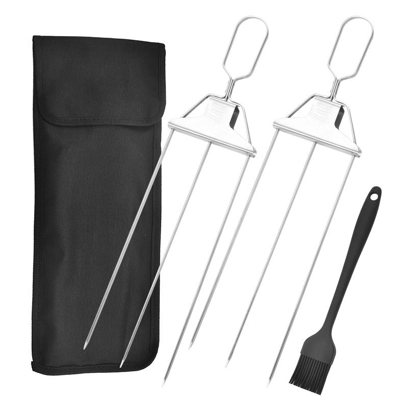 Two three-prong stainless steel skewers, one black silicone brush, and a black fabric storage bag on a white background