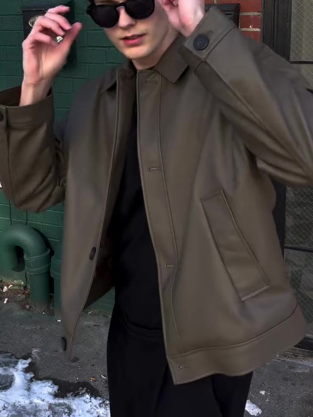 Olive leather-look bomber jacket with shirt collar, front view on model with one hand raised