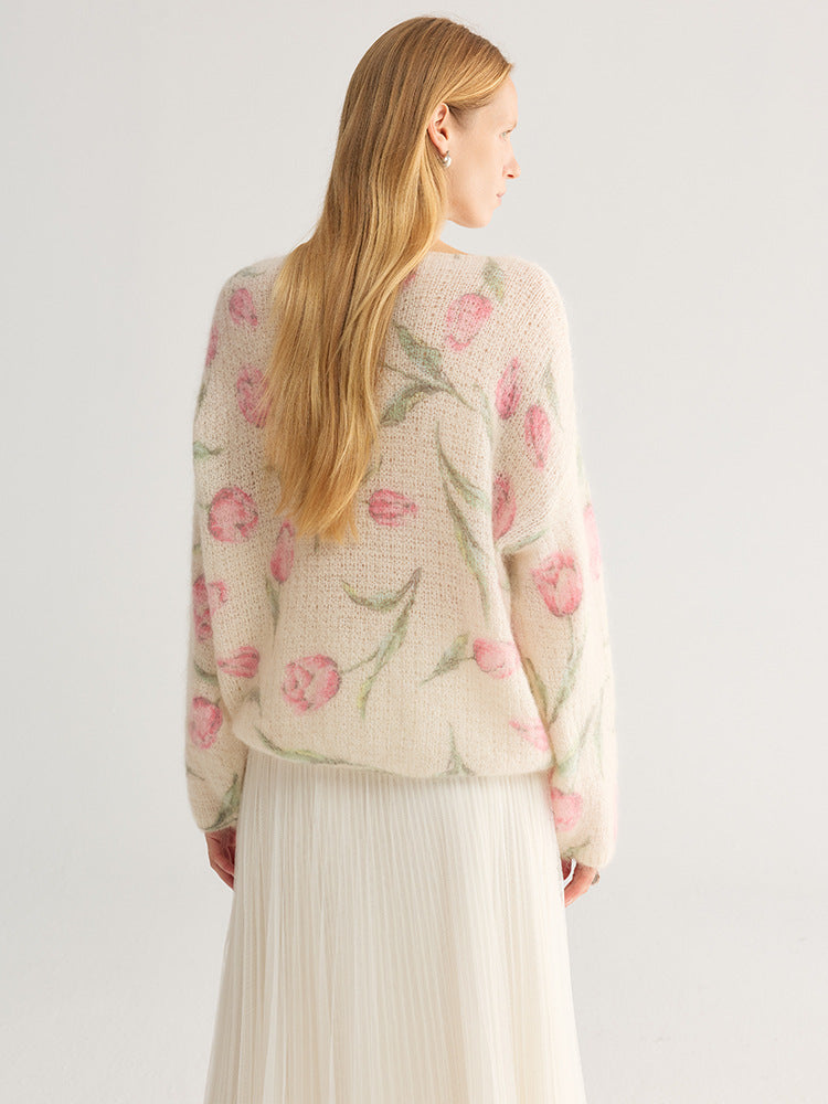 Tulip and floral print fuzzy knit jumper, wide neck, cream with pink flowers, back view on model, studio setting