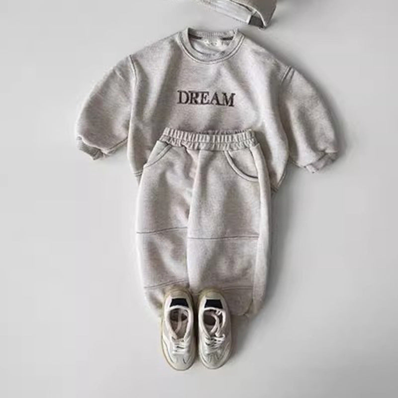 Light grey set laid out with white trainers