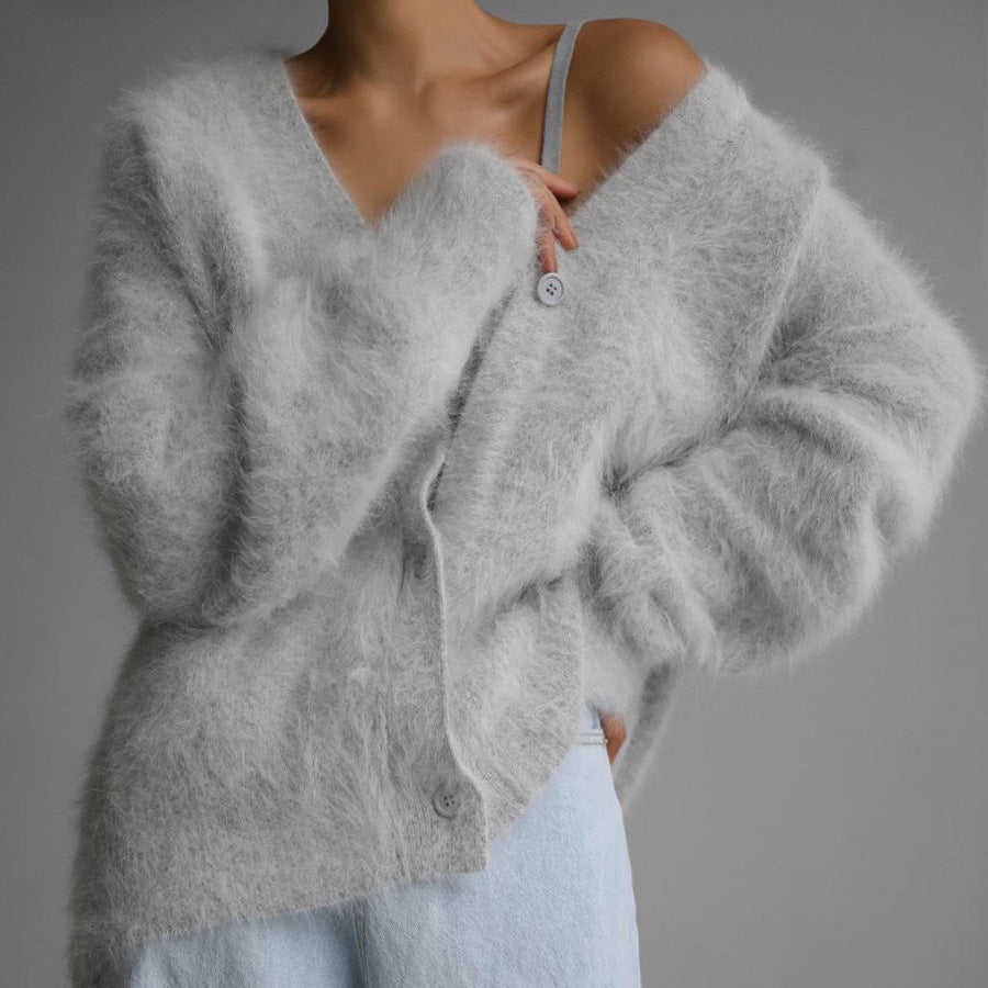 Fluffy oversized V-neck cardigan in grey, front view on model, button front, worn with light blue jeans