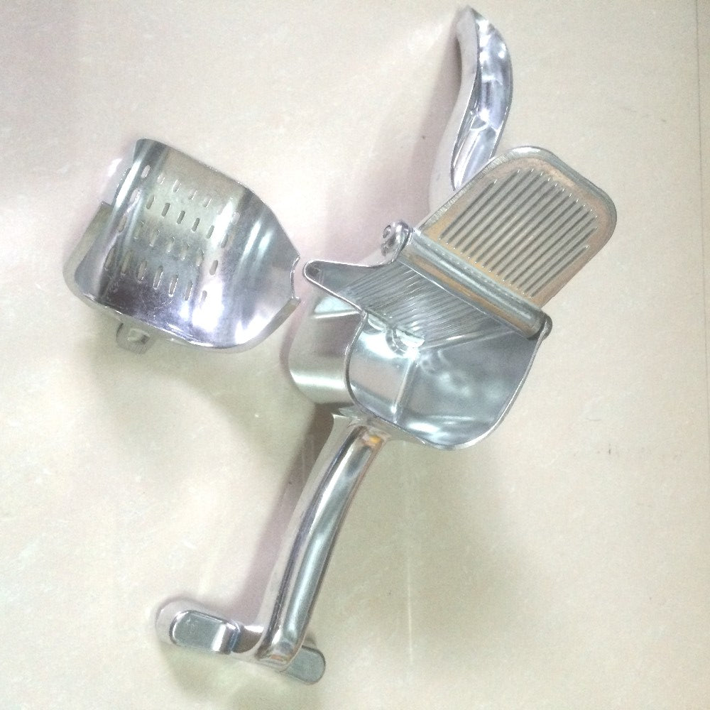 Aluminium hand-lever citrus press with detached bowl and reamer, top view on light surface