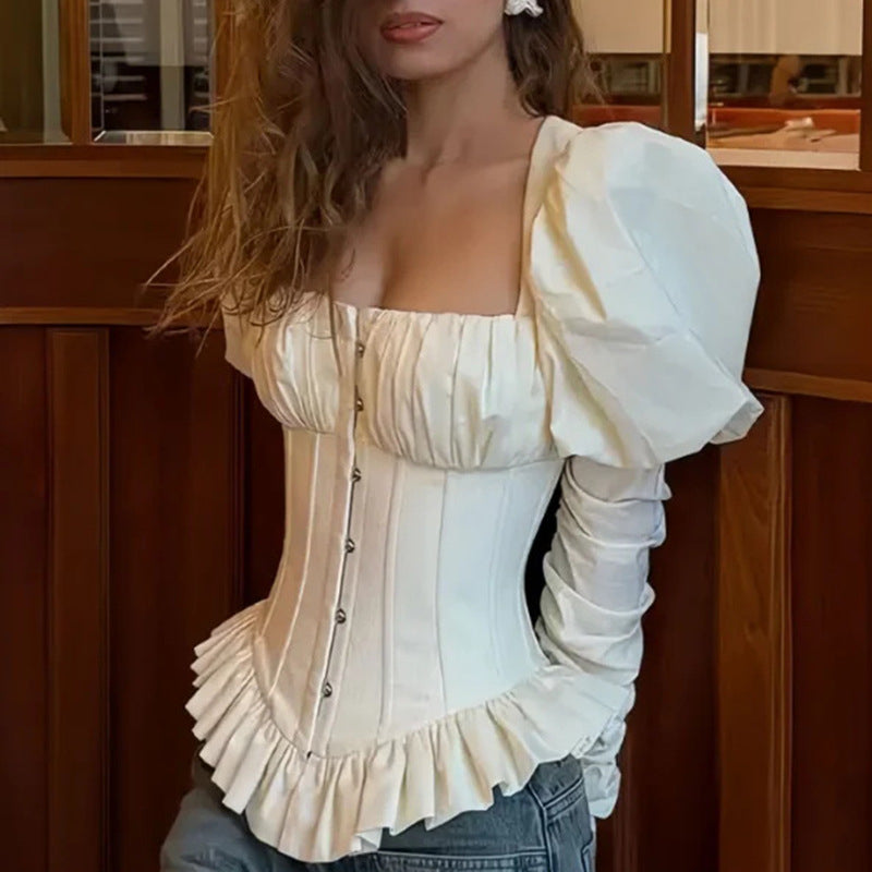 White square-neck corset top with puff sleeves and peplum hem, close-up front view on model