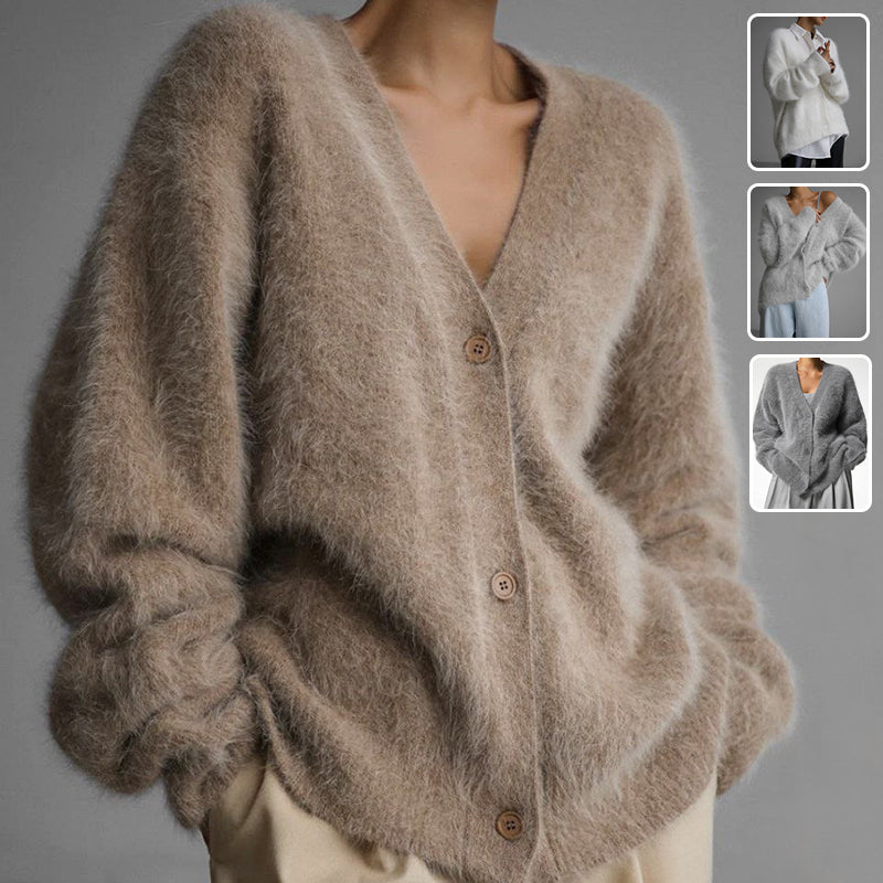 Fluffy oversized V-neck cardigan in beige, front view on model, button front, dropped shoulders, worn with light pants