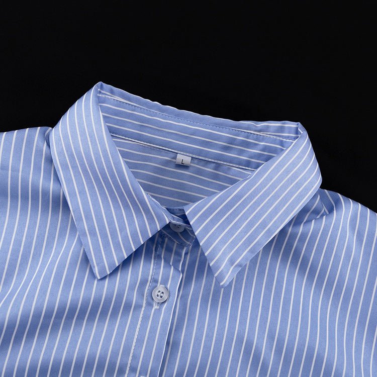 Close-up of the blue and white striped shirt collar and top button placket