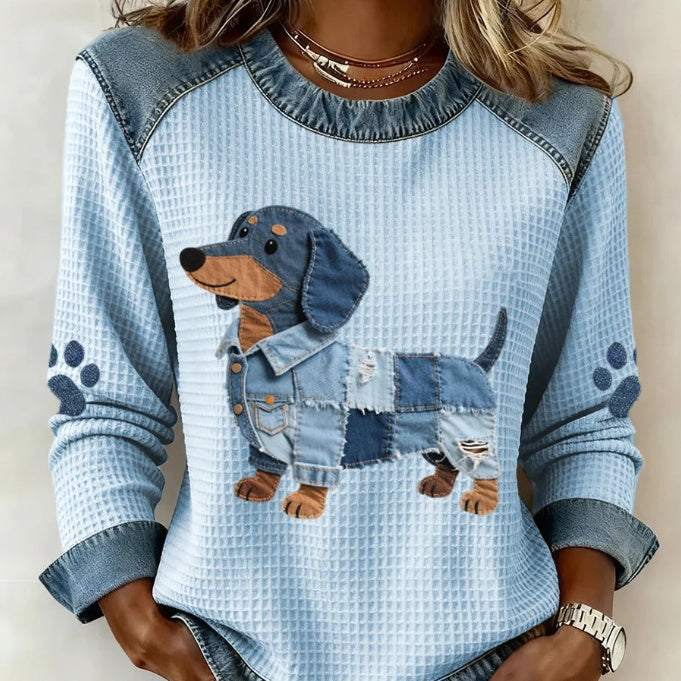 Long-sleeve waffle-knit top with denim-look yoke and dachshund patch design, front view on model