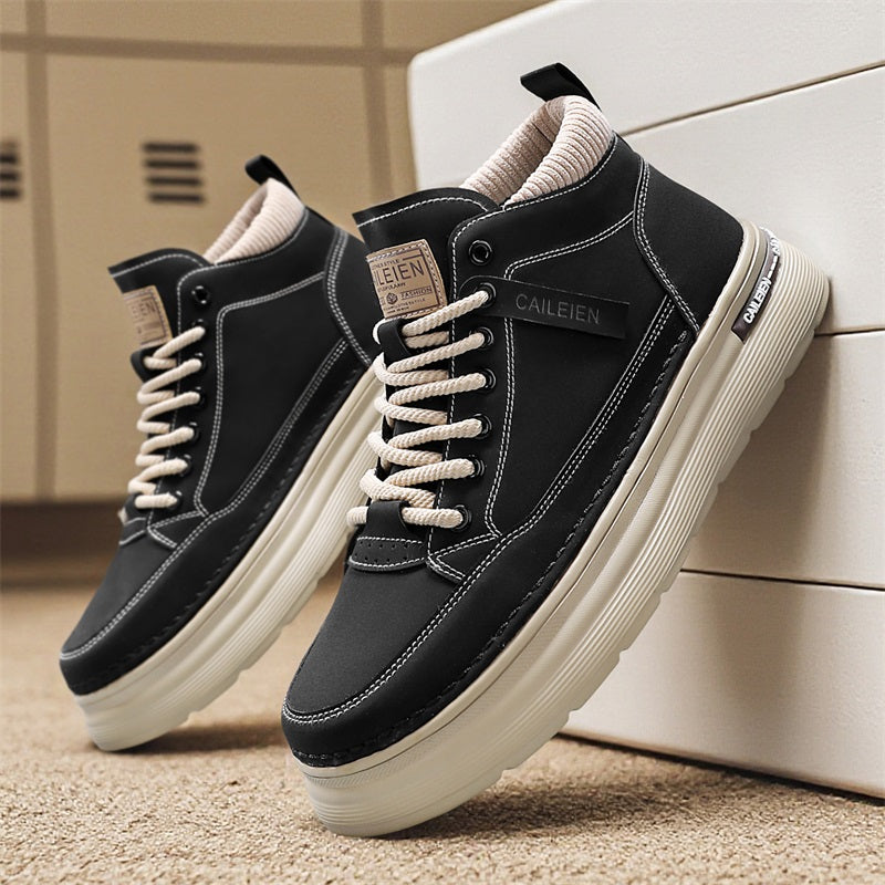 Men's high-top lace-up sneaker boots in black, flat lay, side view, resting against a white surface