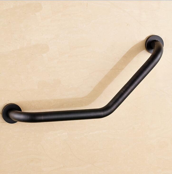 Black wall grab bar, angled design mounted on beige wall