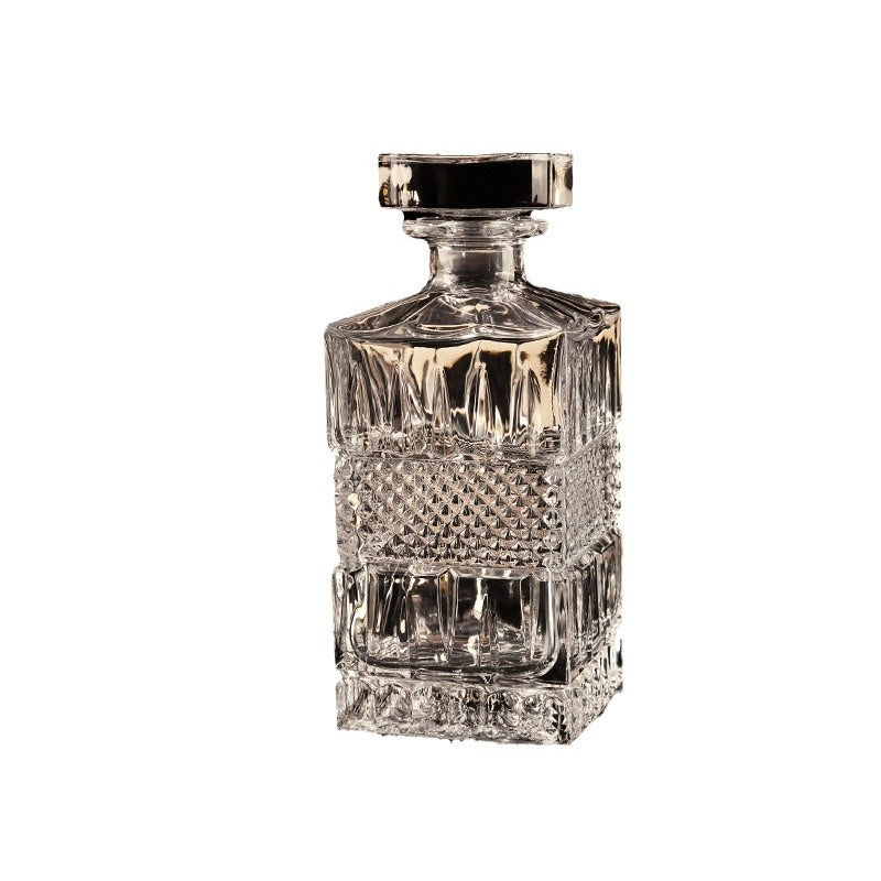 Cut glass spirits decanter with stopper, front view, clear, square shape, on white background