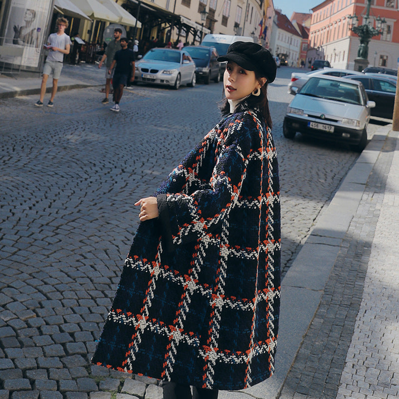 Side view of the oversized check cocoon coat, showing the bell sleeve and cocoon silhouette
