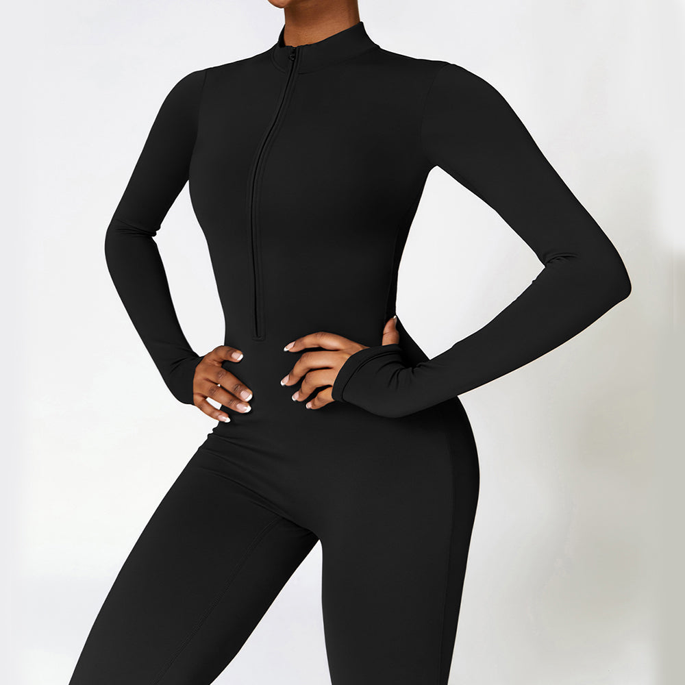 Long-sleeve zip-front brushed jumpsuit in black, front view on model with hands on hips