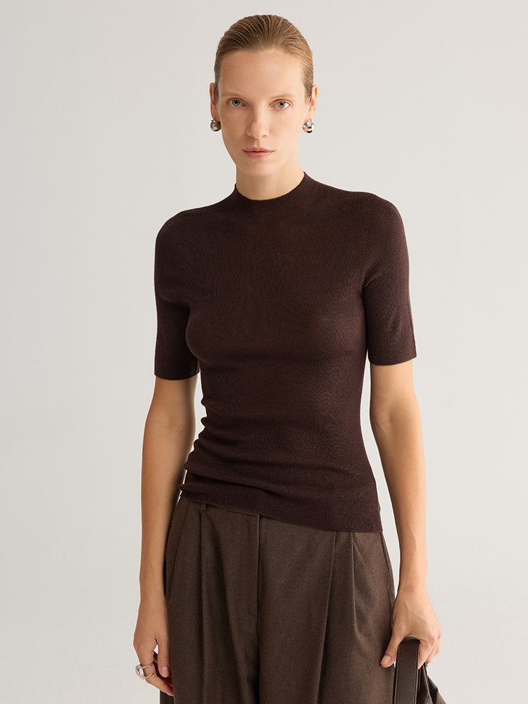 Seamless half-turtleneck knit top, short sleeve, dark coffee, front view on model, plain background