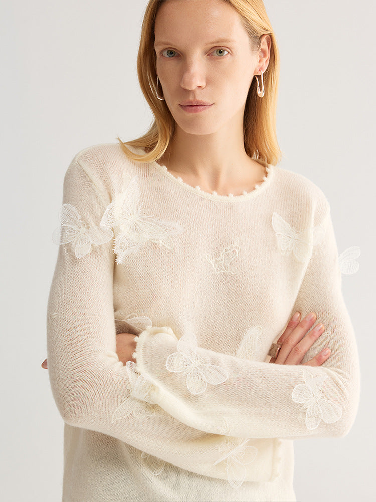 Butterfly Appliqué Crew Neck Knit Top in cream, worn by model, front view, arms crossed, lace butterflies on body and sleeves