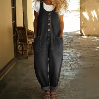 Wide-leg overall jumpsuit in dark denim-look print, front view on model, scoop neck, button placket, large patch pockets