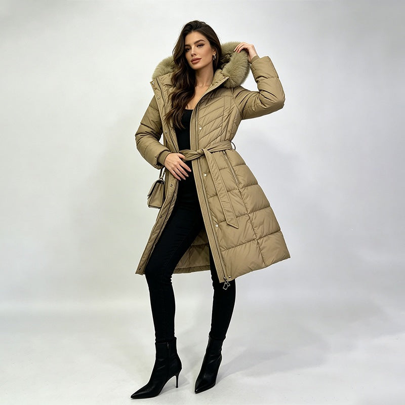 Long belted puffer coat with fur-look hood trim in khaki, front view on model, knee-length, side pockets, self-fabric belt