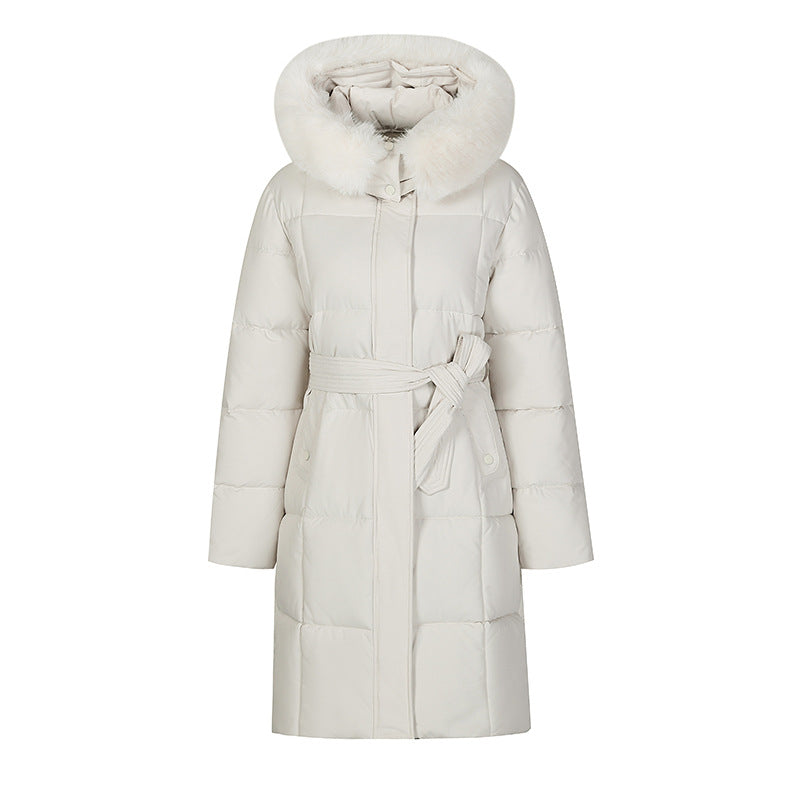 Mid-length padded coat in white with faux-fur hood and tie belt, front view on white background