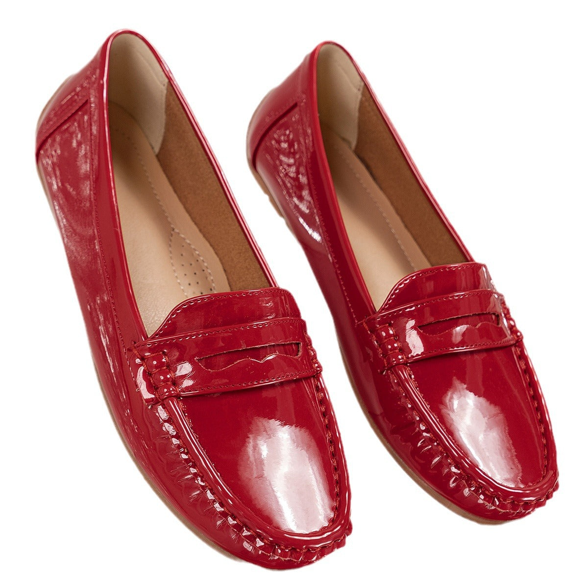Red glossy patent-look penny loafer, flat lay, pair shown from top view on white background
