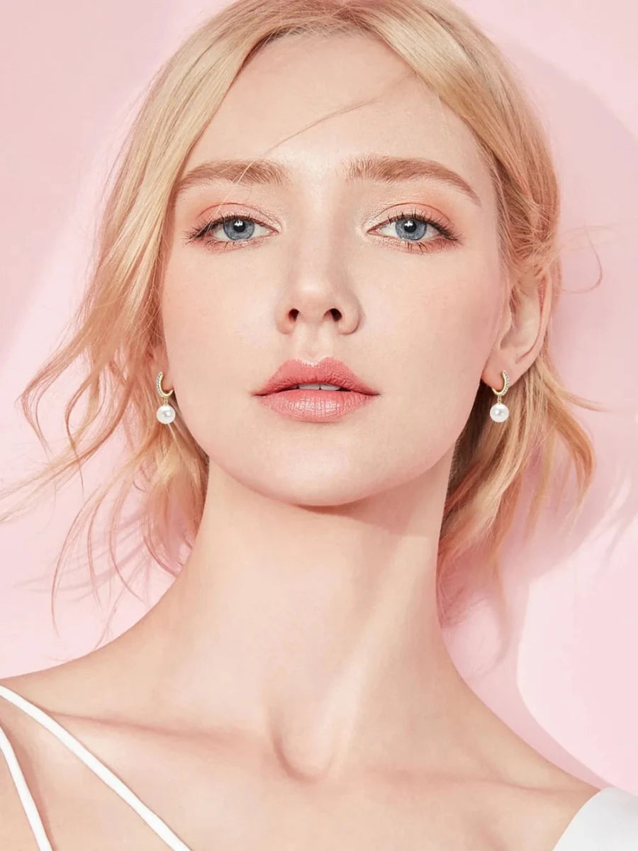 Sterling silver freshwater pearl drop earrings on a white background — elegant jewelry piece
